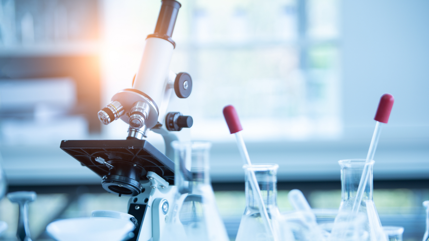 Mobile lab technician preparing blood draw equipment at patient bedside in San Antonio home